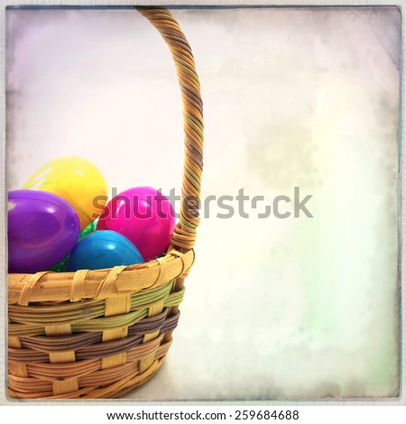 Instagram filtered image of an easter basket and plastic eggs with grain