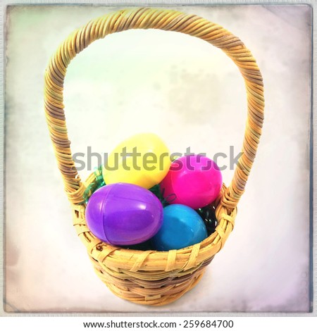 Instagram filtered image of an easter basket and plastic eggs with grain