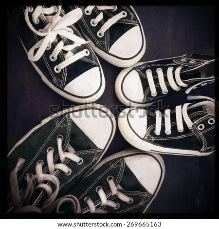 Instagram filtered image of a family concept, shoes in 3 sizes