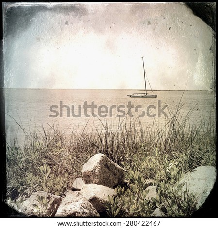 Instagram vintage effect filtered image of a boat on the bay, Outer Banks North Carolina