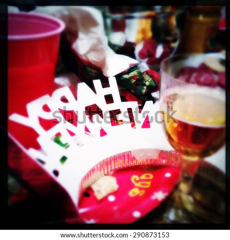 Instagram filtered image of a New Years party hat in an after party mess