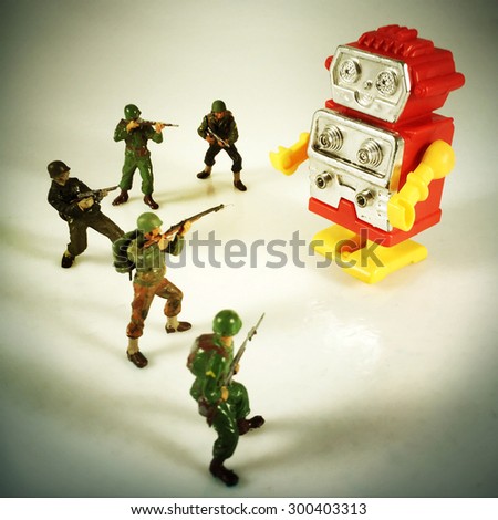 Vintage style Toy Soldiers shooting at robot with an Instagram style filter