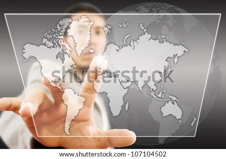 Businessman pushing Social Network world map on tablet screen.