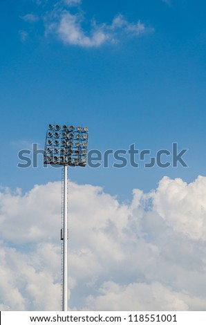 Big sport light in Soccer Stadium with Blue Sky.