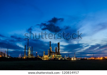 Oil refinery plant at twilight dark blue sky.