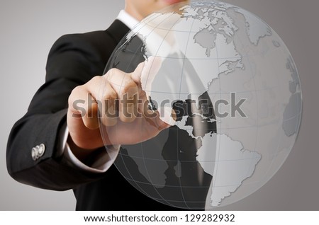 Businessman pushing World Map Globe for Business and Technology Concept.