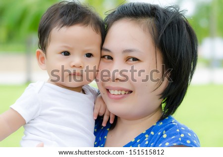 Asian Baby Boy and Mom in the Garden.