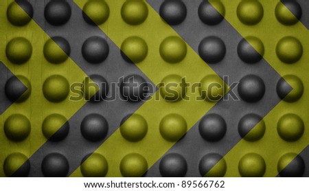 Yellow and black warning sign on bubble texture.