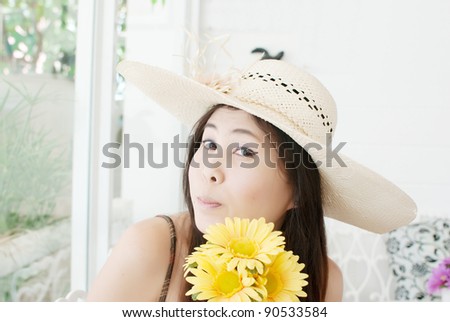 Close up Asian lady with flower.