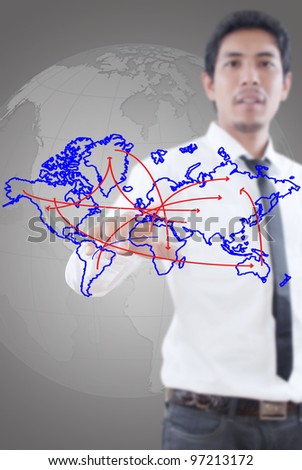 Businessman pushing social network world map.