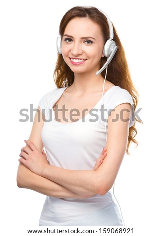 Closeup portrait of lovely young woman talking to customers as a consultant using headset, isolated over white
