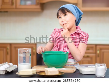 Girl is cooking, thinking while looking up, indoor shoot