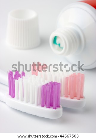 Two toothbrushes and toothpaste