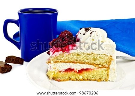 A piece of cake with white cream and red jelly on the plate, blue coffee mug with two pieces of chocolate, blue napkin isolated on white background