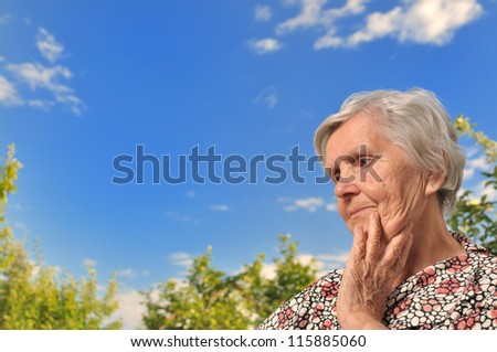 Senior woman - thinking, outdoors. MANY OTHER PHOTOS WITH THIS SENIOR WOMAN IN MY PORTFOLIO.