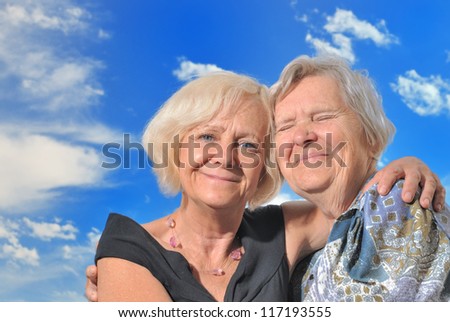 Senior woman with her mother, outdoors. MANY OTHER PHOTOS WITH THIS SENIOR MODEL IN MY PORTFOLIO.