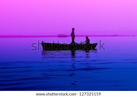 Boat on the river in purple and blue tones.