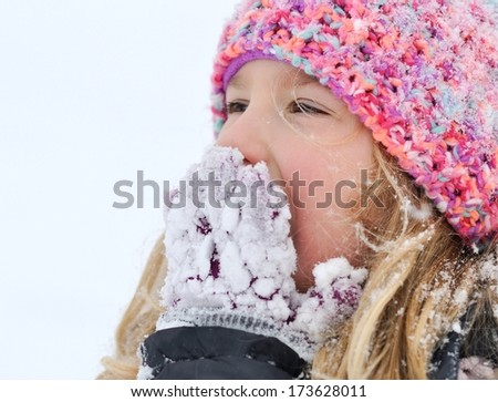 Young girl in a winter scene. MANY OTHER PHOTOS FROM THIS SERIES IN MY PORTFOLIO.