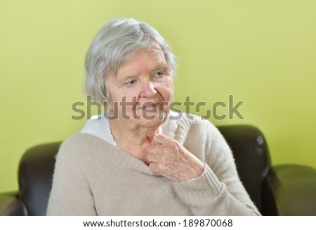 Senior worried woman with grey hairs. MANY OTHER PHOTOS WITH THIS MODEL IN MY PORTFOLIO.