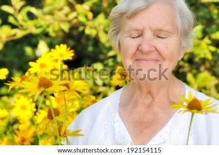 Senior woman in garden full of flowers. MANY OTHER PHOTOS FROM THIS SERIES IN MY - stock-photo-senior-woman-in-garden-full-of-flowers-many-other-photos-from-this-series-in-my-portfolio-192154115