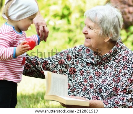 Grandmother and granddaughter. Happy and smiling family.  MANY OTHER PHOTOS FROM THIS SERIES IN MY PORTFOLIO.