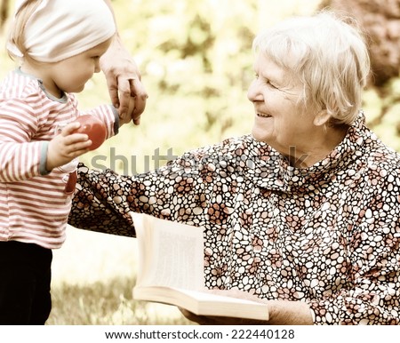 Grandmother and granddaughter. Happy and smilling family. Vintage style.