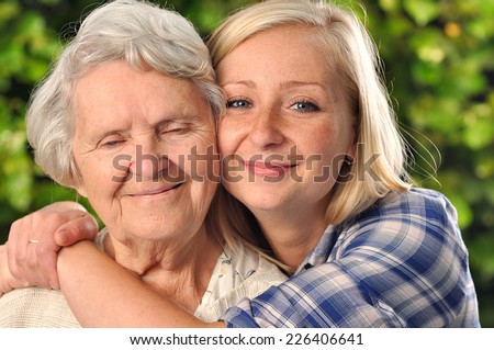 Grandmother and granddaughter. Young woman takes care of an elderly, senior woman. MANY OTHER PHOTOS FROM THIS SERIES IN MY PORTFOLIO.