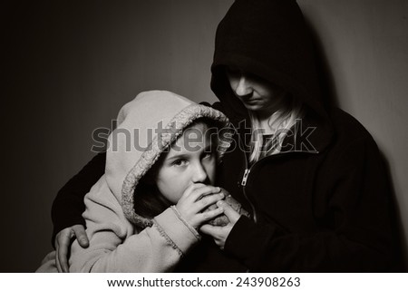 Homeless mother with her daughter. Poor family. MANY OTHER PHOTOS FROM THIS SERIES IN MY PORTFOLIO.