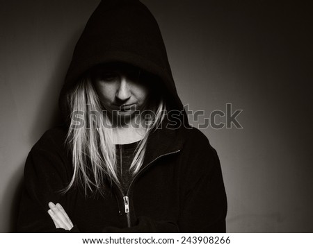 Rebellious teenager in a hoodie. MANY OTHER PHOTOS FROM THIS SERIES IN MY PORTFOLIO.