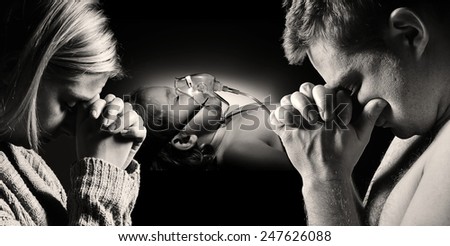 Parents pray for the health of seriously ill daughter. MANY OTHER PHOTOS FROM THIS SERIES IN MY PORTFOLIO.