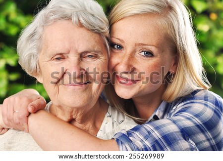 Grandmother and granddaughter. Young woman takes care of an elderly woman. MANY OTHER PHOTOS FROM THIS SERIES IN MY PORTFOLIO.