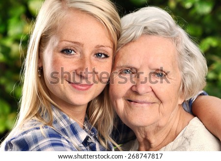 Grandmother and granddaughter. Young woman takes care of an elderly woman. MANY OTHER PHOTOS FROM THIS SERIES IN MY PORTFOLIO.