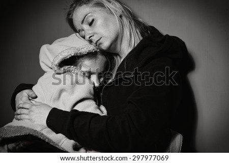 Homeless mother with her daughter. Poor family. MANY OTHER PHOTOS FROM THIS SERIES IN MY PORTFOLIO.