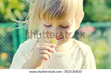 Cute little girl in the sunshine.  MANY OTHER PHOTOS FROM THIS SERIES IN MY PORTFOLIO.