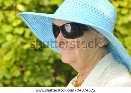 Funny senior woman with sunglasses. MANY OTHER PHOTOS WITH THESE MODEL IN MY PORTFOLIO - http://www.shutterstock.com/sets/434319-senior-people.html?rid=718525