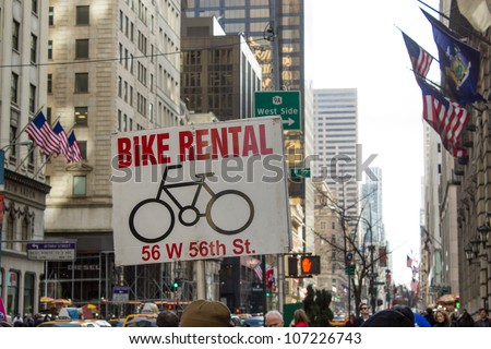NEW YORK CITY - MARCH 9: Bike Rental sign indicates where to find a Bike in crowded Manhattan, March 9, 2011 in New York City