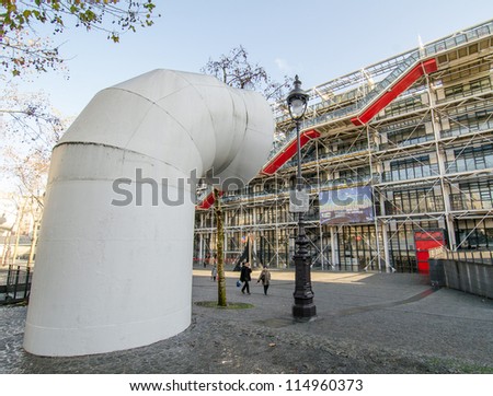 PARIS - NOV 19: People walks among the pipelinesis of Centre Pompidou. The center is a complex in the Beaubourg area designed in the style of high-tech architecture, November 19th, 2011 in Paris.