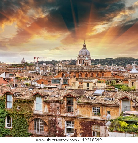 Wonderful view of Rome at sunset with St Peter Cathedral.