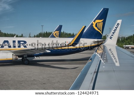 PISA, ITALY - JUN 9: Ryanair Jet airplanes ready for take-off, June 9, 2010 in Pisa, Italy. Ryanair is the biggest low-cost airline company in the world