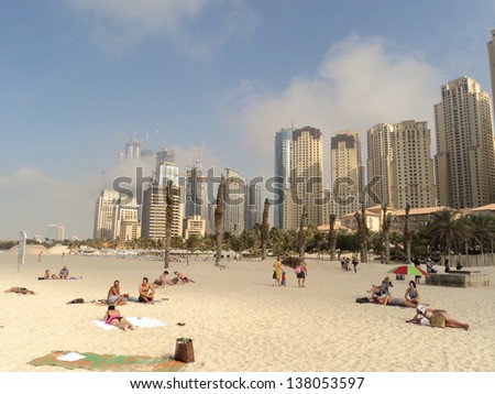 Dubai, Uae - Jan 9: Tourists Relax On City Beach, January 9, 2011 In Dubai. More Than 10 Million People Visit The City Every Year.