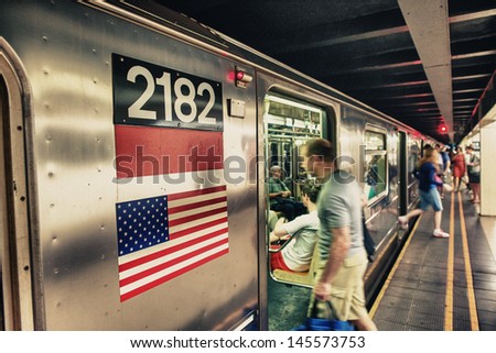 New York City - Jun 11: People Wait For Subway Train, June 11, 2013 In New York City. The New York City Subway Is Also One Of The World\'S Oldest Public Transit Systems.