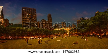 NEW YORK CITY - JUN 8: People relax in Bryant Park garden at sunset, June 8, 2013 in NYC. Bryant Park is a 9.603 acre (39,000 mÃ?Â?Ã?Â²) privately managed public park surrounded by skyscrapers.