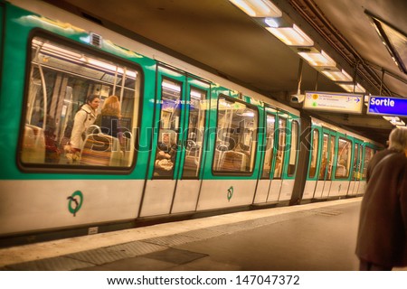 PARIS, DEC 4: Underground train inside a metro station, December 4, 2012 in Paris. Paris Metro is the 2nd largest underground system worldwide by number of stations (300)