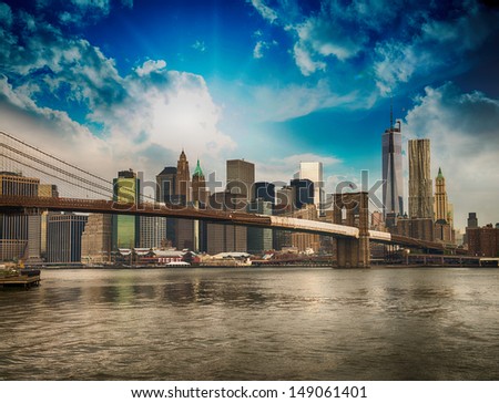 Beautiful Wideangle View Of Brooklyn Bridge And Manhattan Skyline On A Overcast Summer Day.