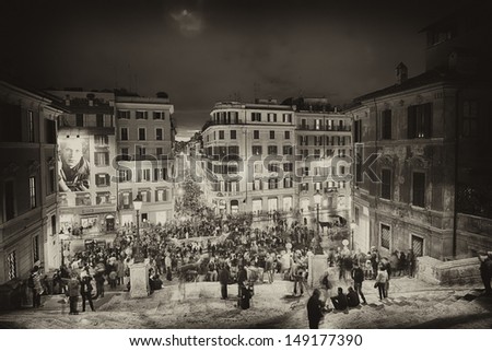 ROME - NOV 3: People climb the spanish steps of Piazza di Spagna on the evening of November 3, 2012 in Rome. The \'scalinata\' is the widest staircase in Europe