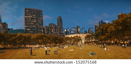 NEW YORK CITY - JUN 8: People relax in Bryant Park garden at sunset, June 8, 2013 in NYC. Bryant Park is a 9.603 acre (39,000 mÂ²) privately managed public park surrounded by skyscrapers.