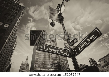 Library Way and 5th Avenue street sign in New York City Library Way and 5th Avenue street sign in New York City