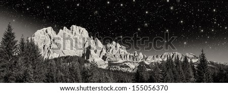 Stars in the night above Dolomites Mountains.