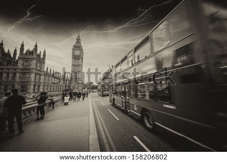 Storm in London with Red Bus crossing Westminster Bridge.