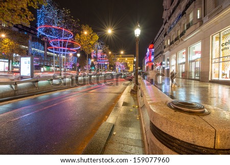 PARIS, NOV 30: Car light trails in famous Champs Elysees, November 30, 2012 in Paris. The avenue runs for 1.91 km (1.18 mi) through the 8th arrondissement.